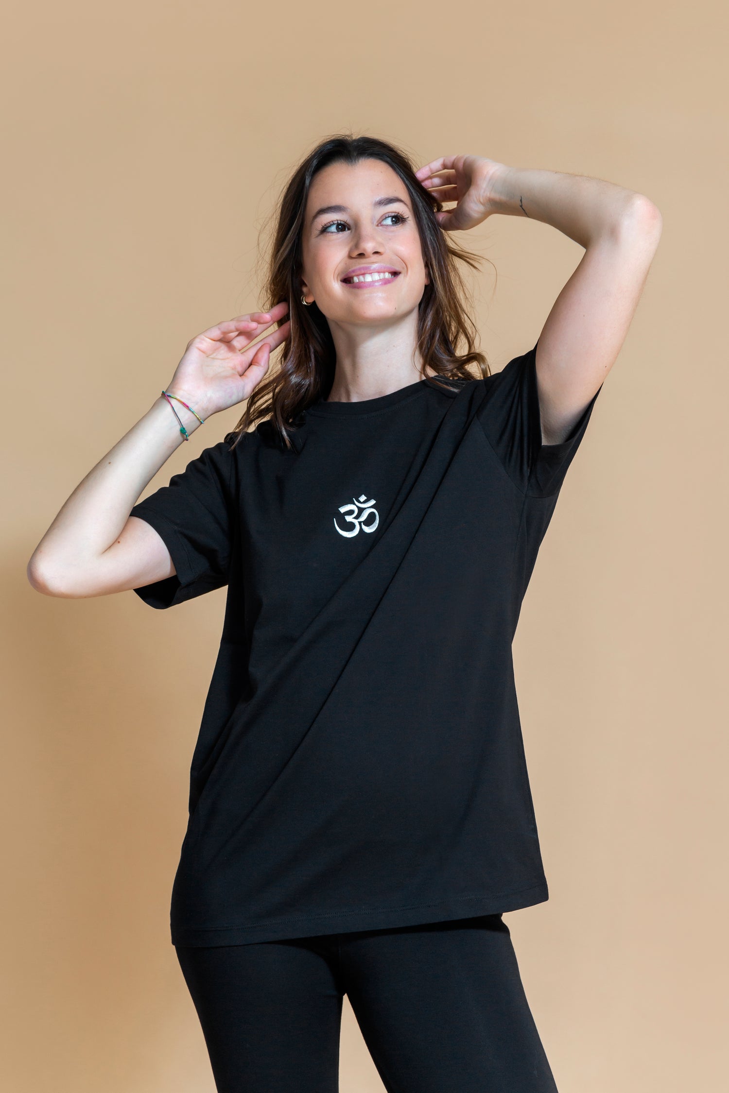 Sustainable Om yoga T-Shirt in Black for women crafted from OCS certified organic cotton Shambhala Barcelona.